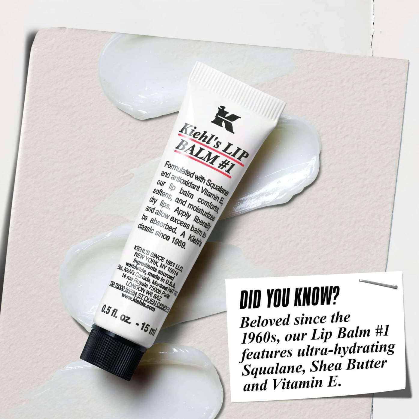 Tuba balzama Lip Balm #1 na beli površini z besedilom: »Ali ste vedeli? Formulirano s skvalanom, karitejevim maslom in vitaminom E za navlažene, bolj gladke ustnice.«
