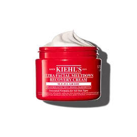 Rdeča posodica kreme Kiehl’s Ultra Facial Meltdown Recovery Cream Whip s teksturo stepene smetane.