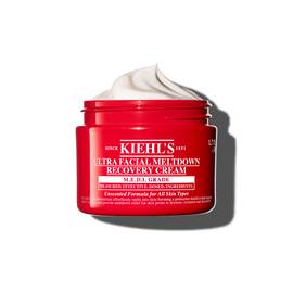 Rdeča posodica kreme Kiehl’s Ultra Facial Meltdown Recovery Cream Whip s teksturo stepene smetane.