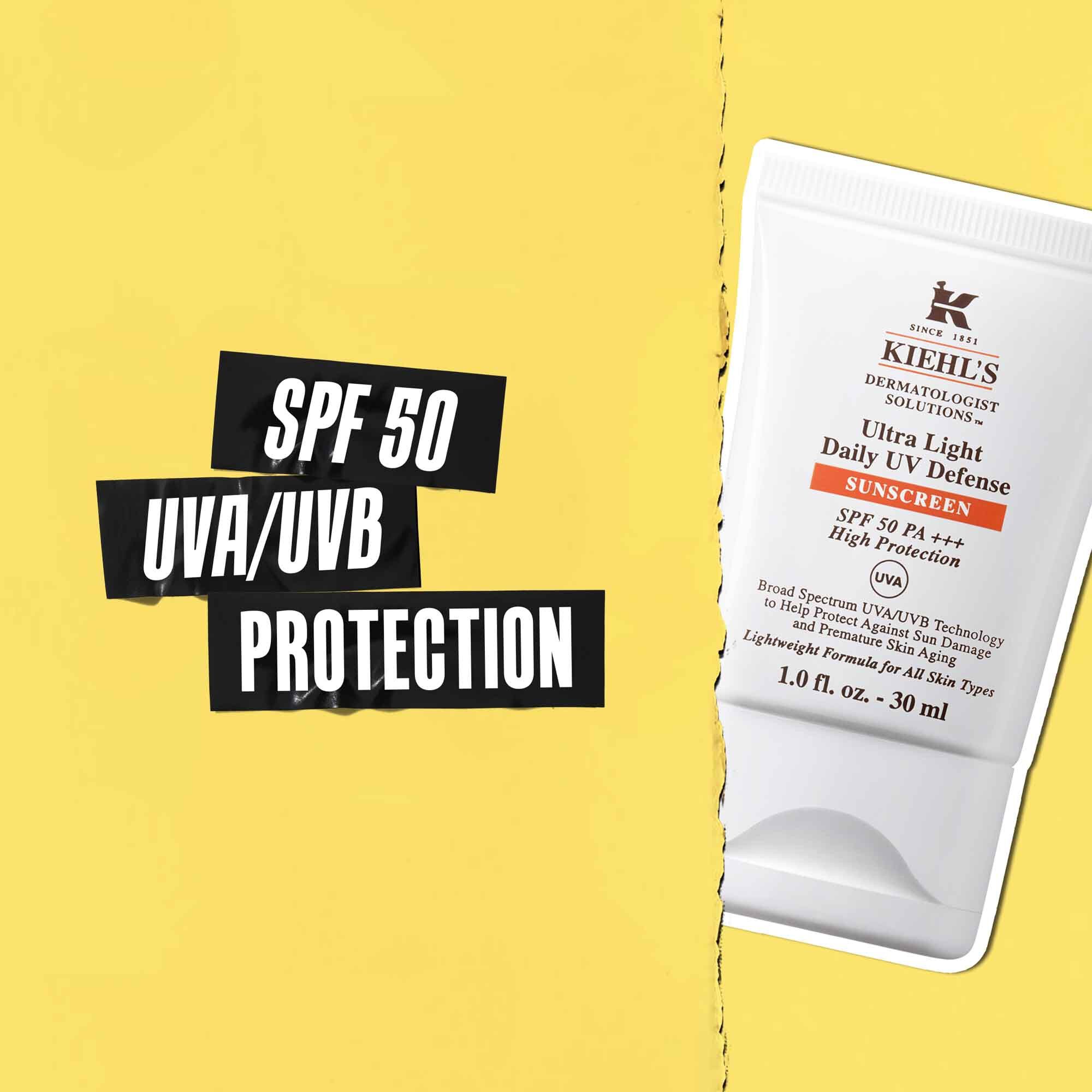 Oznaka zaščite SPF 50 UVA/UVB na črnem traku s sliko tube Ultra-Light Daily UV Defense ob njej.