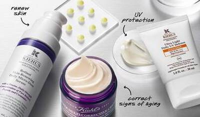 Izdelki za nego kože Kiehl's: serum za pomlajevanje, krema za obraz in zaščita pred UV žarki.