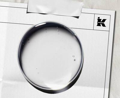 Close-up of translucent bubbles in a light blue background, showcasing varying sizes and shapes.