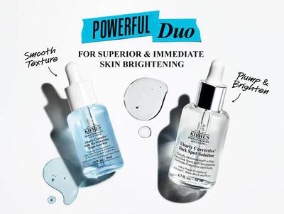 Two skincare serums are displayed on a white background, accompanied by droplets of liquid. The text above reads "POWERFUL Duo for Superior & Immediate Skin Brightening," highlighting the benefits of smooth texture and brightening effects.