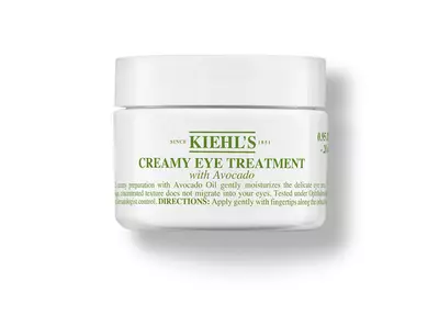Kiehl's kremna obdelava oči z avokadovim oljem v beli embalaži, namenjena vlaženju občutljive kože okoli oči.
